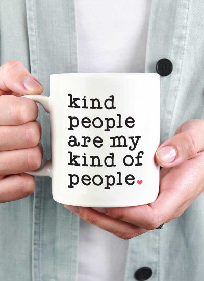 Woman holding White Coffee Mug with Saying "Kind People are My Kind of People" in Vinyl - Square Format