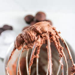 homemade chocolate buttercream frosting on a mixer whisk attachment